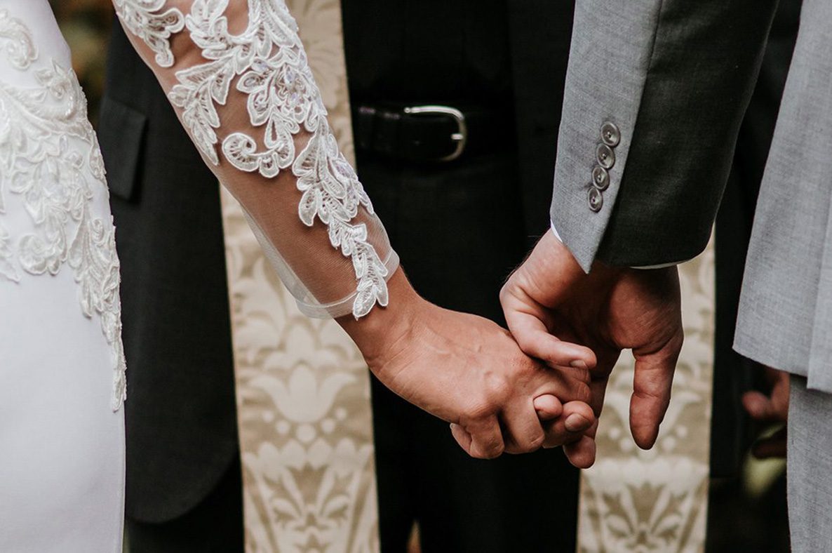 Image of a couple holding hands